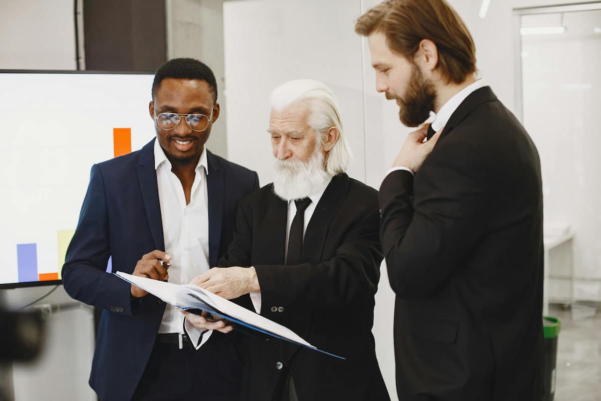 Businessmen Looking at Documents